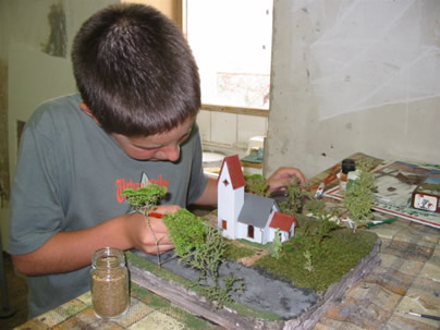 F-Hallier-A child finishing a scale model during an initiation week